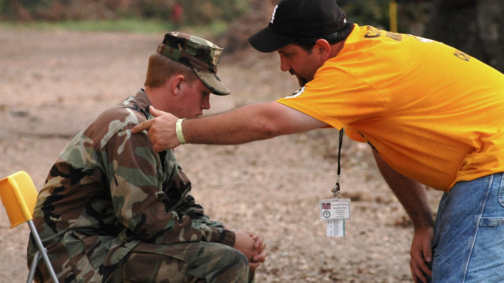 Volunteer Minister helps a soldier after Katrina
