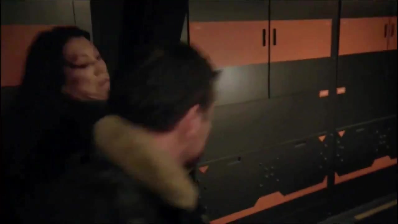 Ming-Na Wen as Melinda May grabbing McKay Stewart as Roughneck against orange lockers