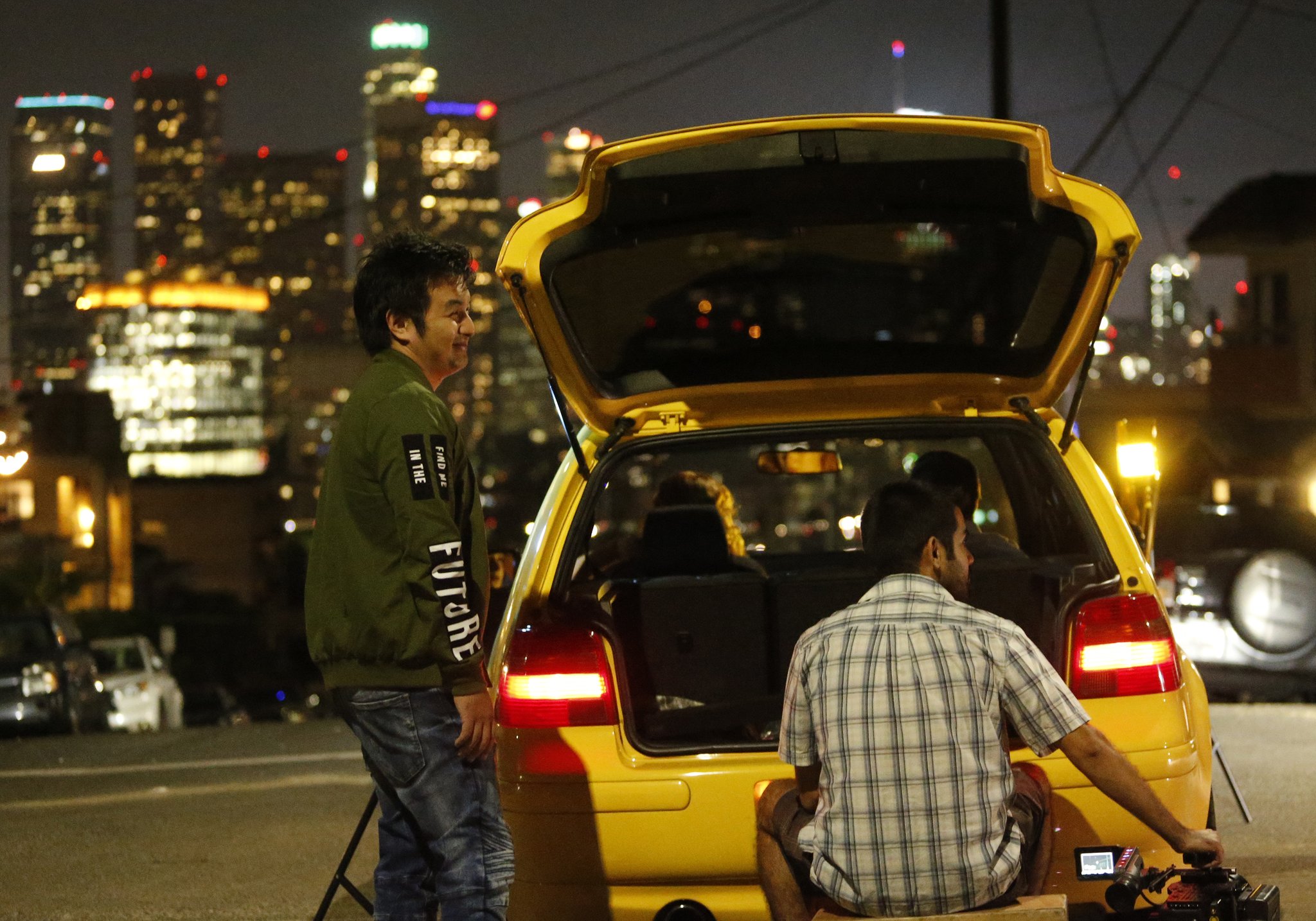 Behind the scenes night shoot with Dan Liu and a cinema camera on a Los Angeles hillside overlooking downtown