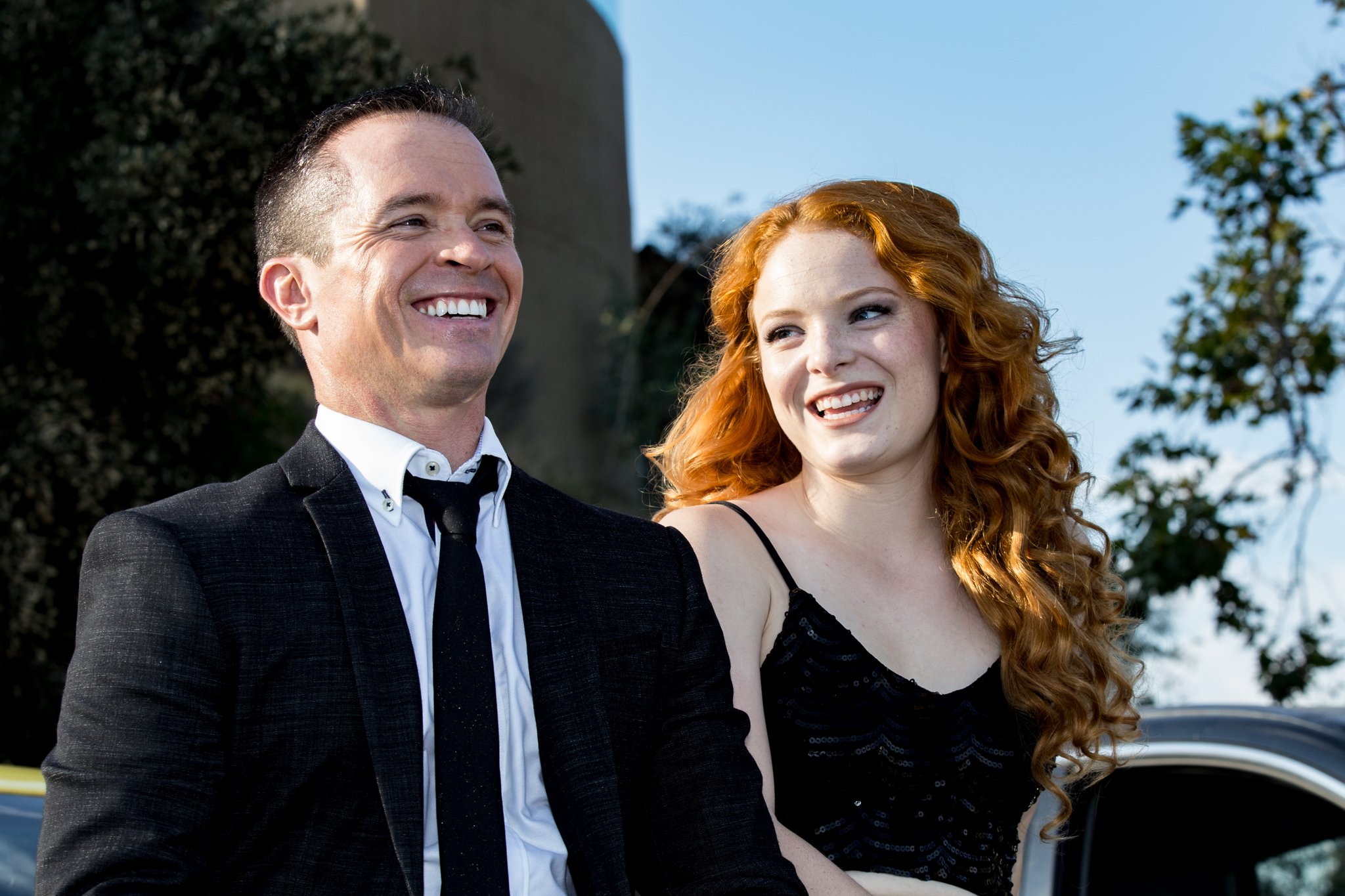 McKay Stewart and Tea McKay smiling on location during the Bond music video shoot